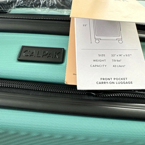 New! CALPAK 22” Hardside Carry-on Spinner With Front Pocket